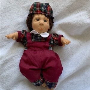 The cutest sad little boy doll.